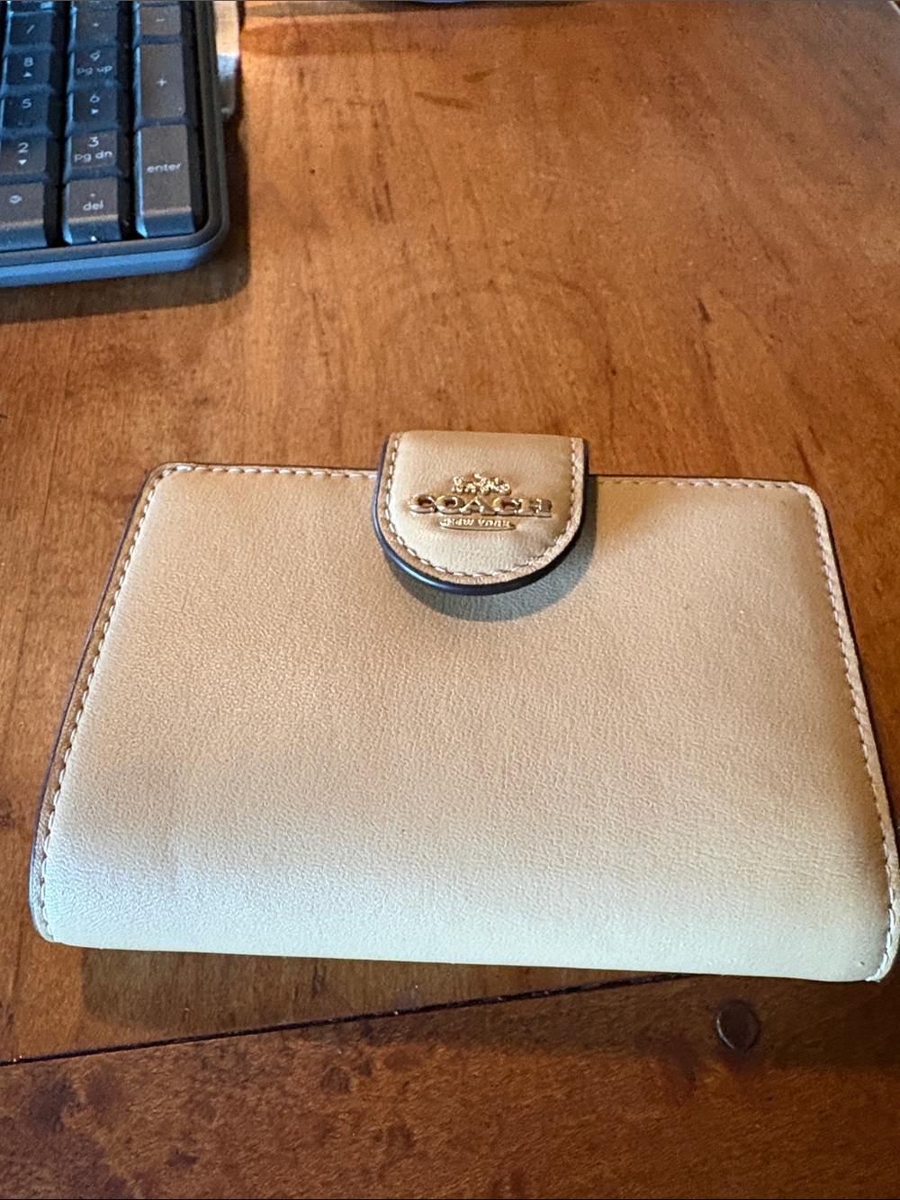 Beige Coach medium sized wallet